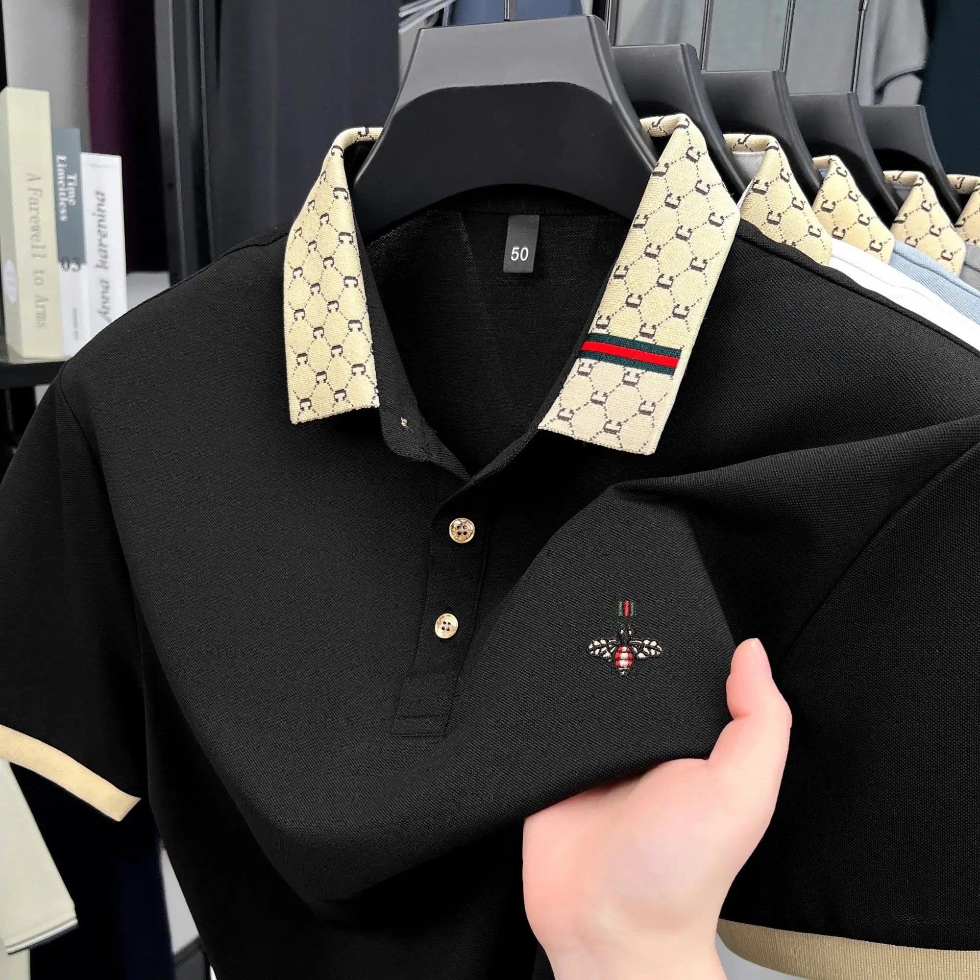 Men's black polo shirt with beige jacquard collar and bee embroidery
