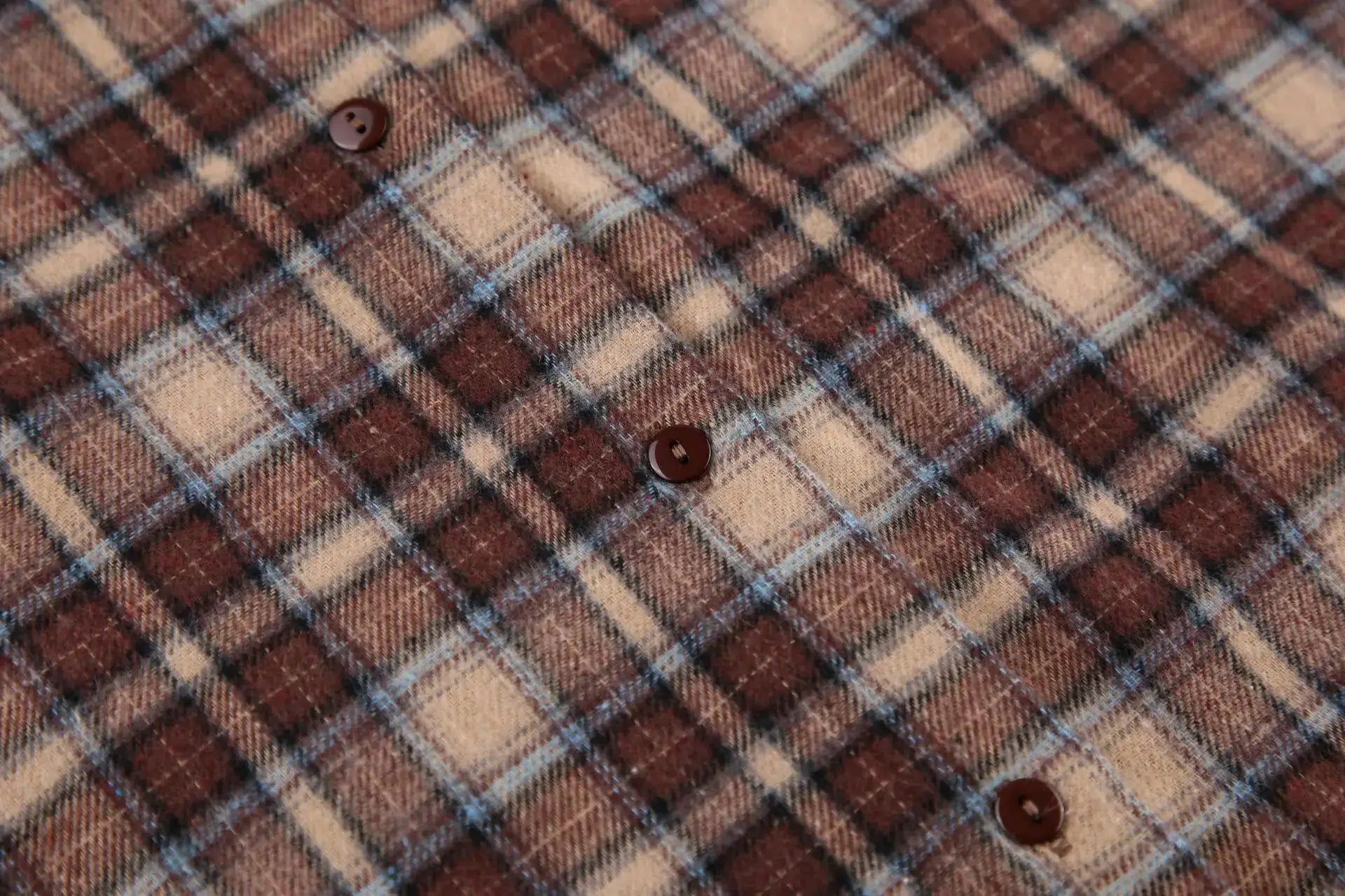 Plaid checkered shirt fabric in brown and beige with brown buttons; vintage long-sleeve casual shirt