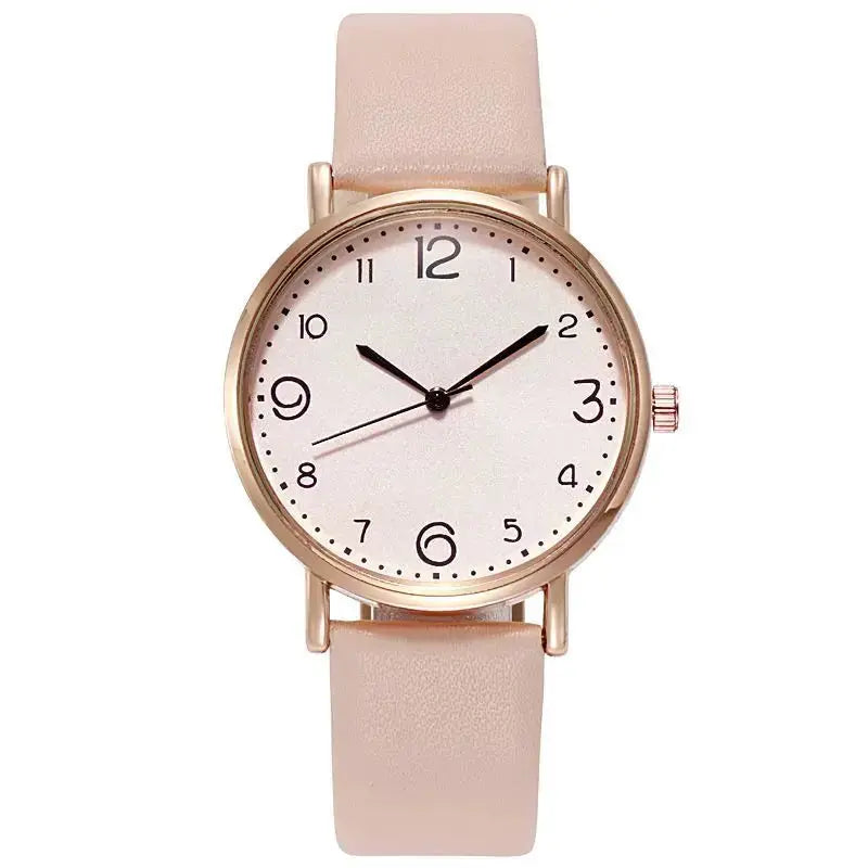 Women’s watch by Simples Market with pink leather strap, rose gold-tone case, white dial, Arabic numerals.