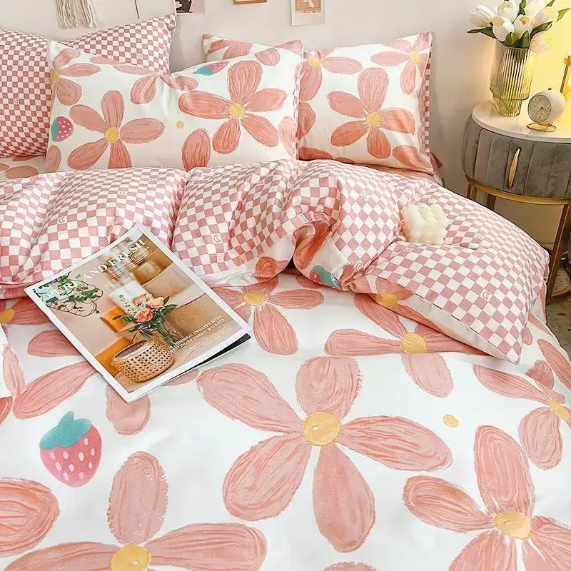 Pink floral bedding set with checkered reverse; queen size duvet cover, flat sheet, and pillowcases