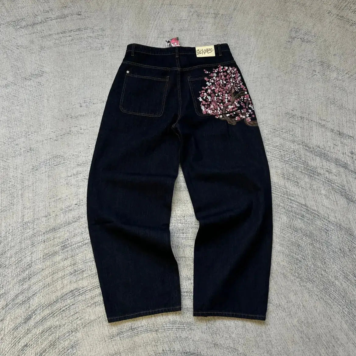 Denim jeans, vintage low-waist wide-leg, dark indigo with cherry blossom embroidery on back pocket; Simples Market