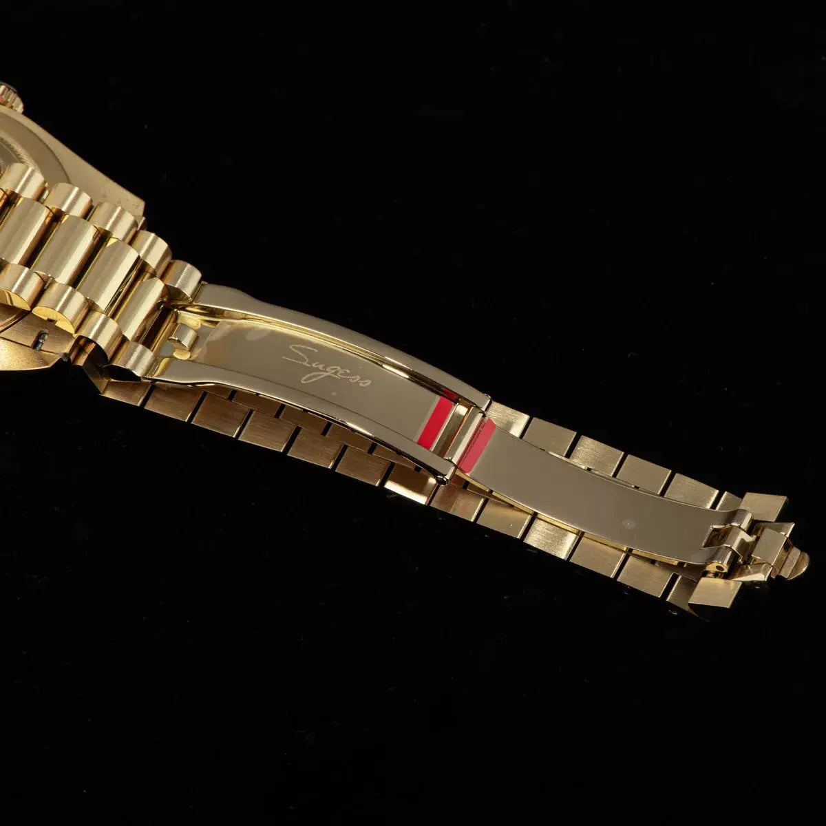 Sugess gold-tone men's wristwatch bracelet with engraved Sugess logo on clasp, stainless steel.