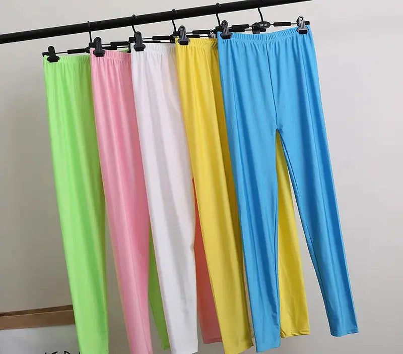 High-elastic skinny leggings on a rack in six colors; shiny yoga pants for women