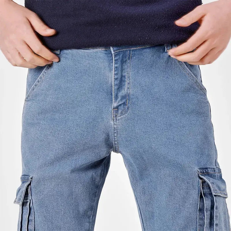 Men's denim cargo pants with elastic waist and multiple pockets in washed blue.