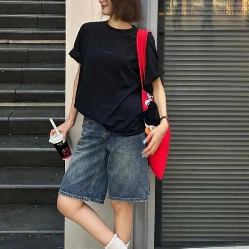 Women’s wide-leg knee-length denim shorts in blue, high-waist casual style.