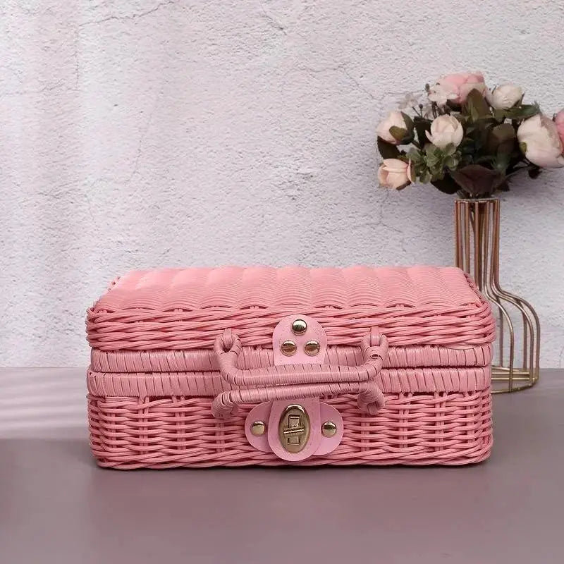 Pink rattan-like finishing box, retro woven storage case with handle and brass latch.