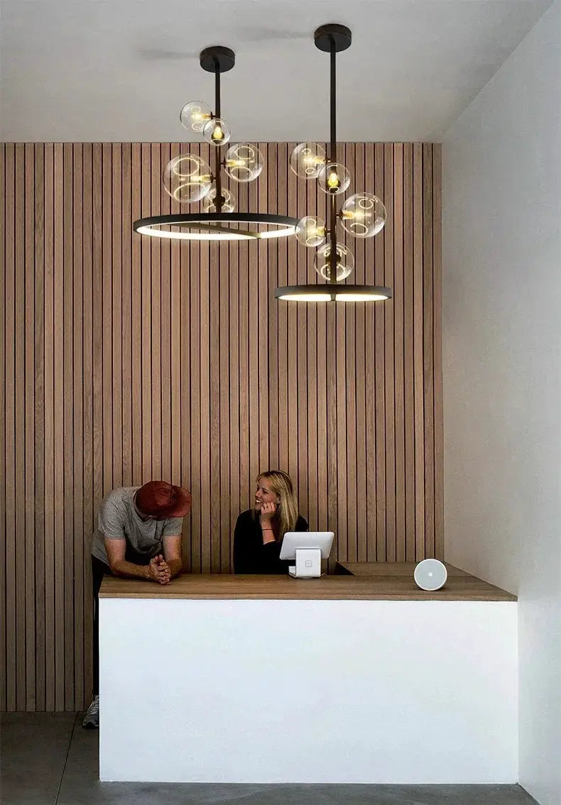 Modern Art Glass Chandelier by Simples Market; black metal frame with two circular LED rings and glass globes