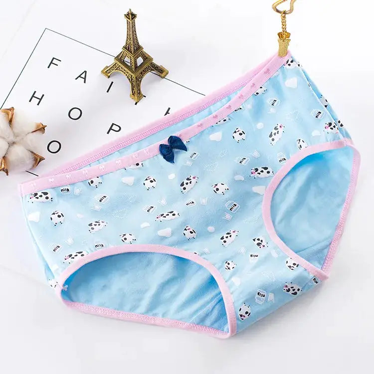 Women's blue cotton seamless panties with pink trim and a small bow detail, cartoon print