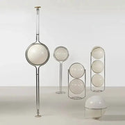 Five-piece set of modern white acrylic circular globe lamps in chrome frames, including a tall floor lamp and several globe lamps.