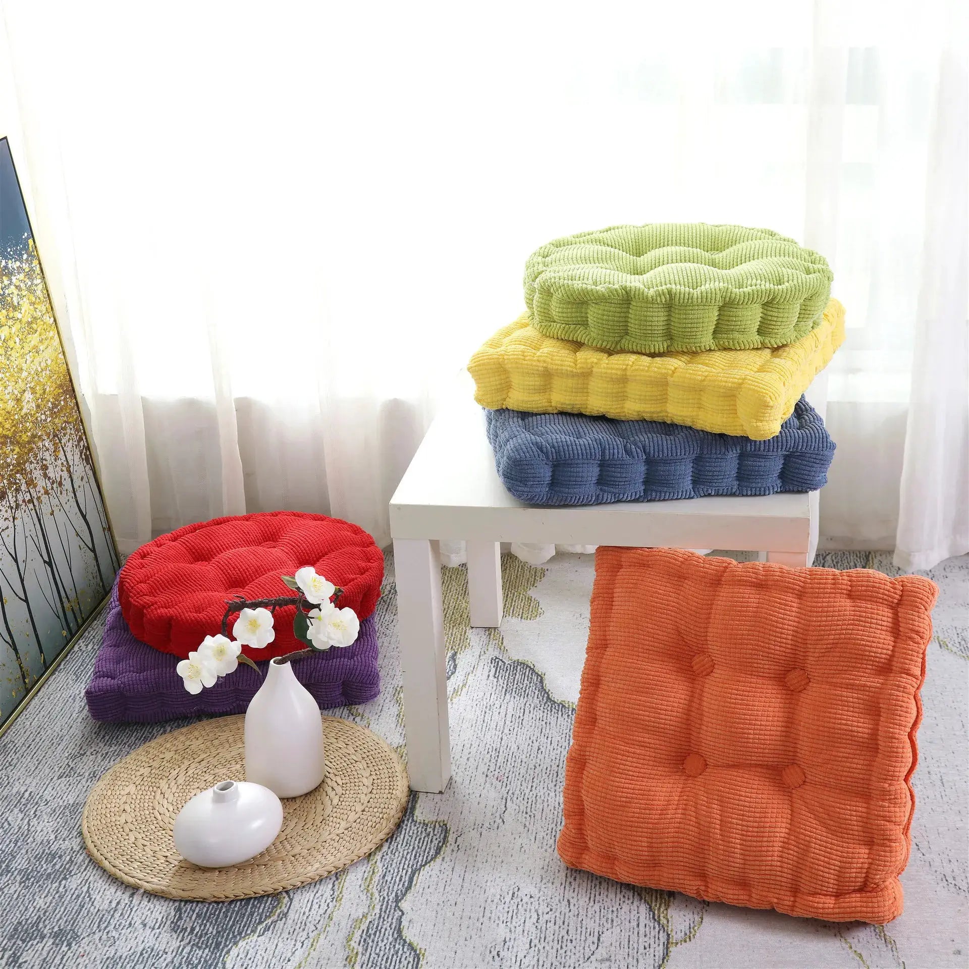 Simples Market tufted seat cushions 50x50cm; thick square chair pads in green, yellow, blue, orange, red, purple stacked on a white table.