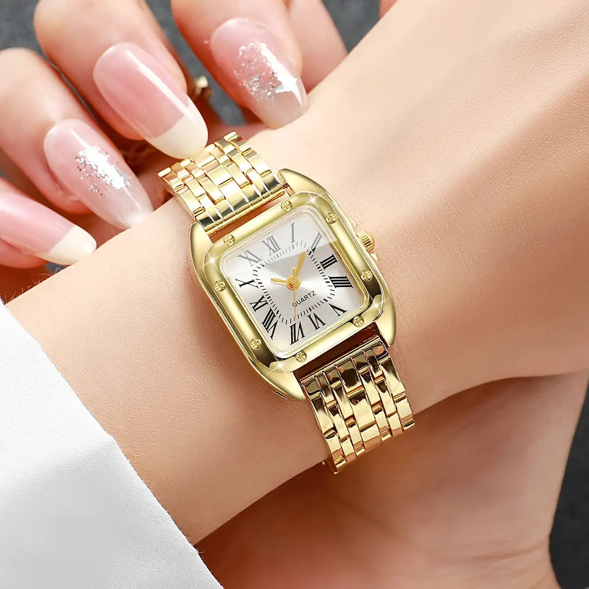 Gold-tone square women's quartz watch with Roman numeral dial and metal bracelet.