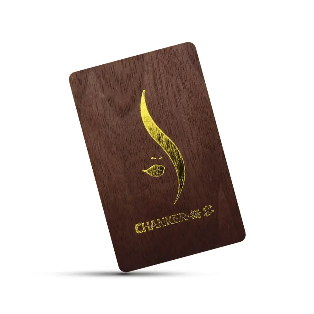 Wooden NFC lasercard by CHANKER with gold engraving on dark brown wood