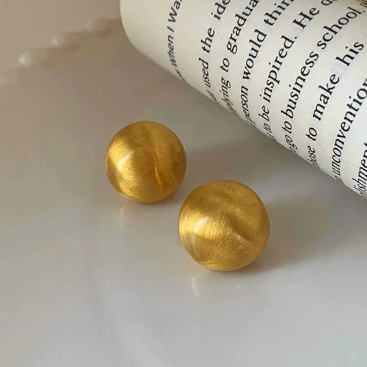 Gold brushed metal round stud earrings, frosted finish, pair