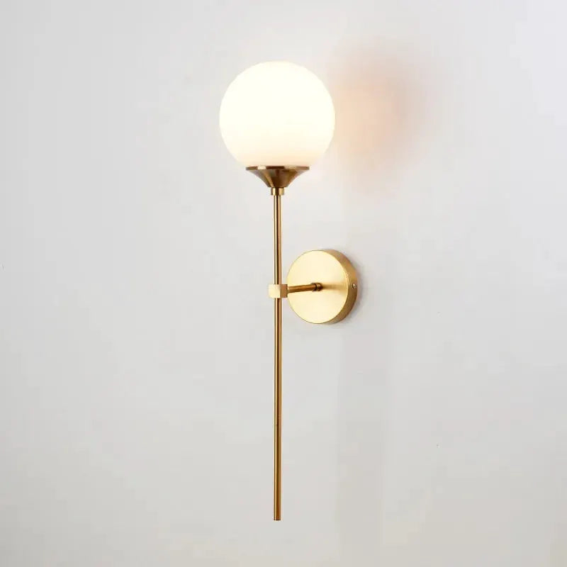 Simples Market modern glass wall lamp; brass gold sconce with a round glass globe for bedroom or living room.