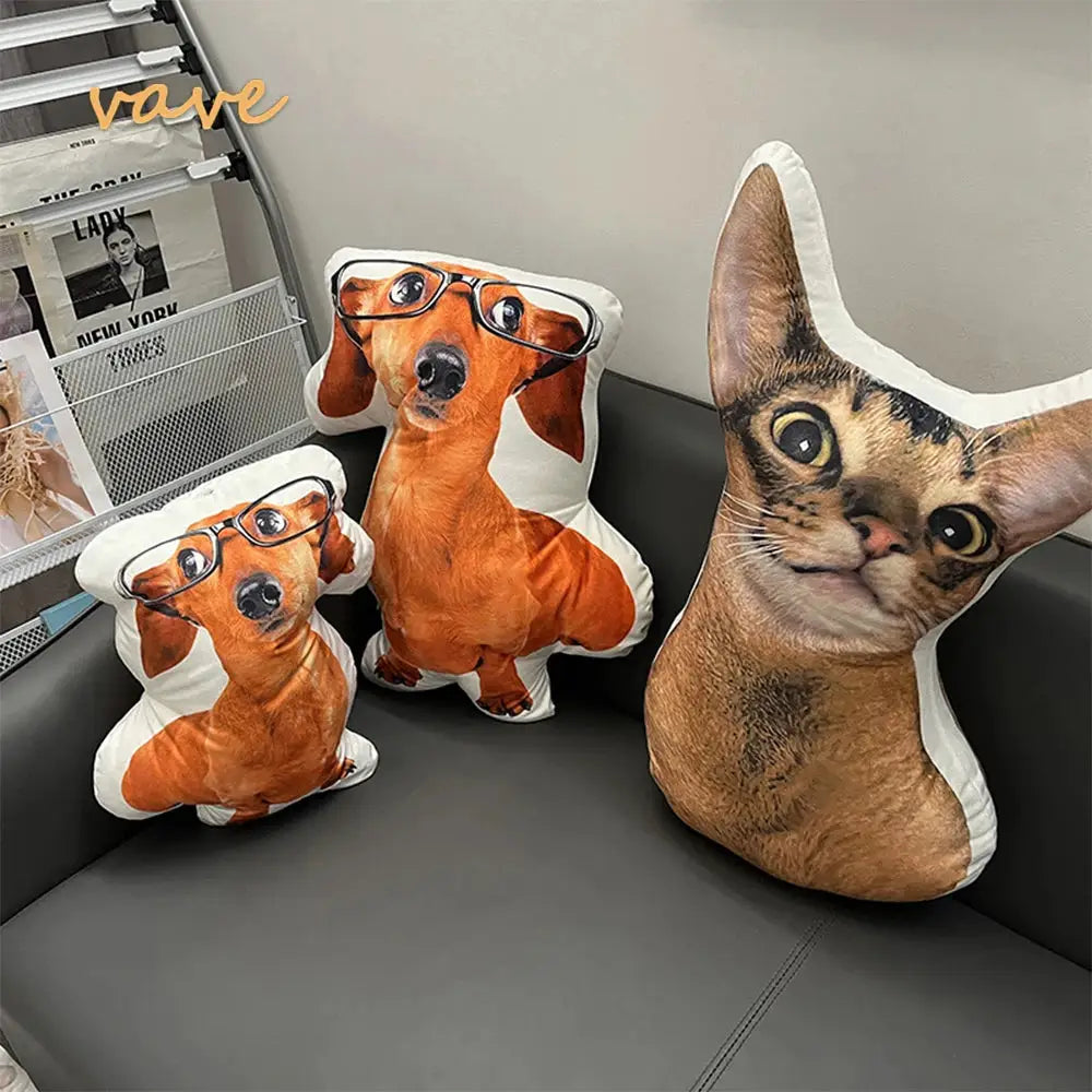 Photo custom shape pillows: two orange dachshund cushions with glasses and one cat-shaped plush on a gray sofa.