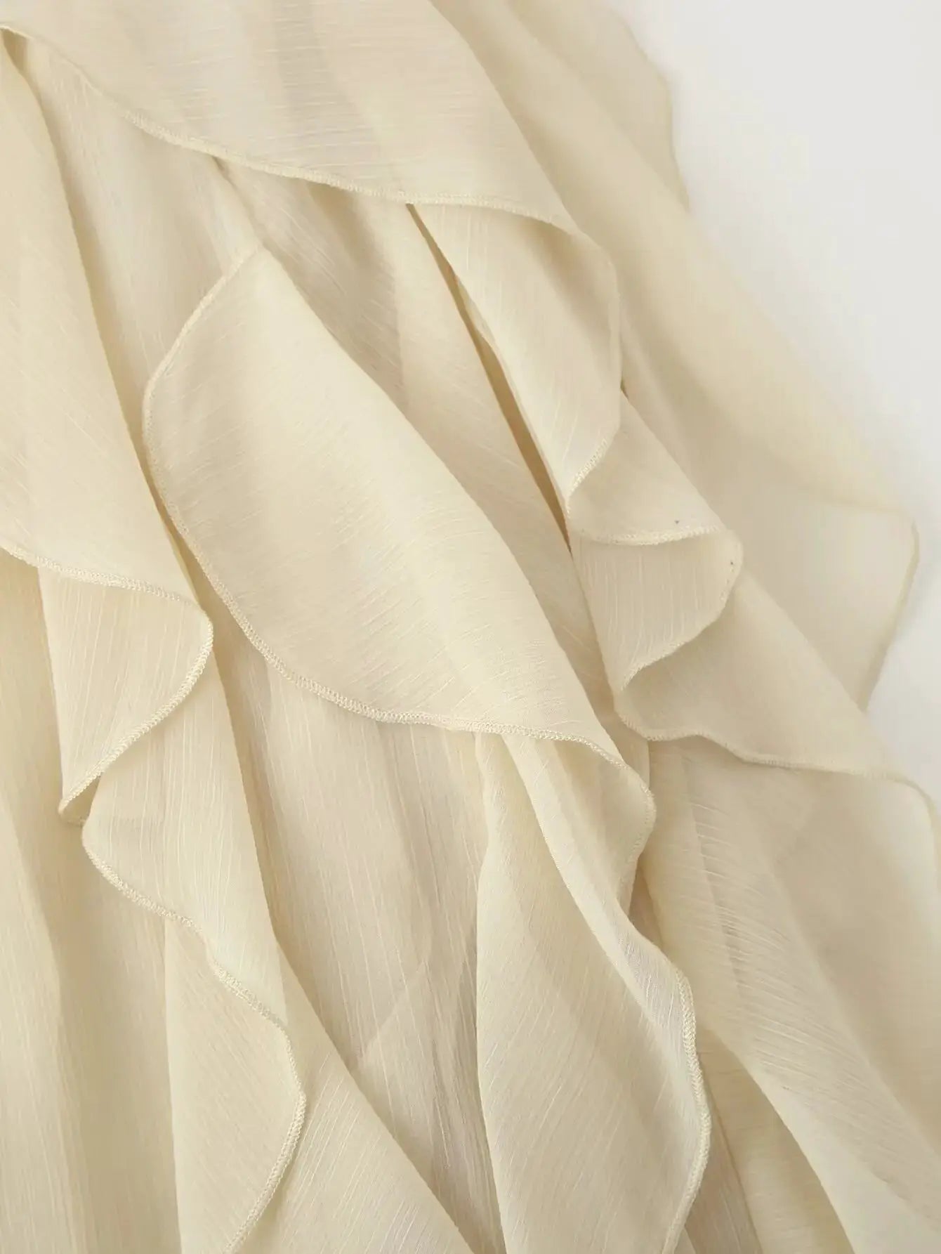 YENKYE cream chiffon blouse with layered ruffle detailing close-up