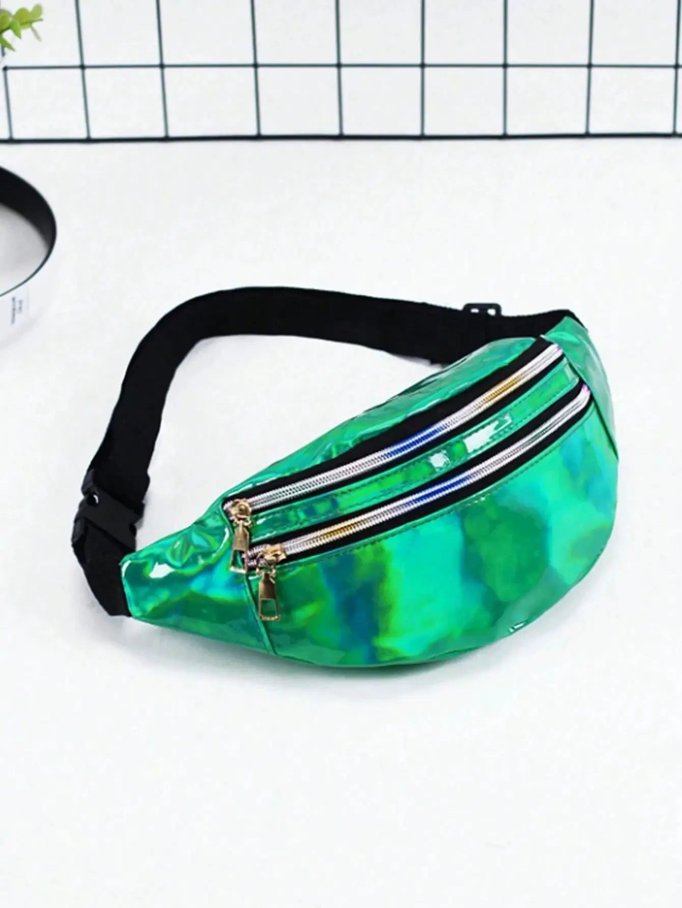 Holographic waist bag with black adjustable strap and double gold-zipped compartments