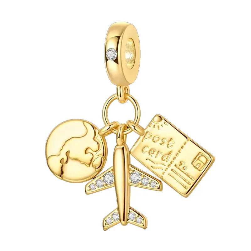 Gold-tone charm bracelet set with globe, airplane and credit card pendants