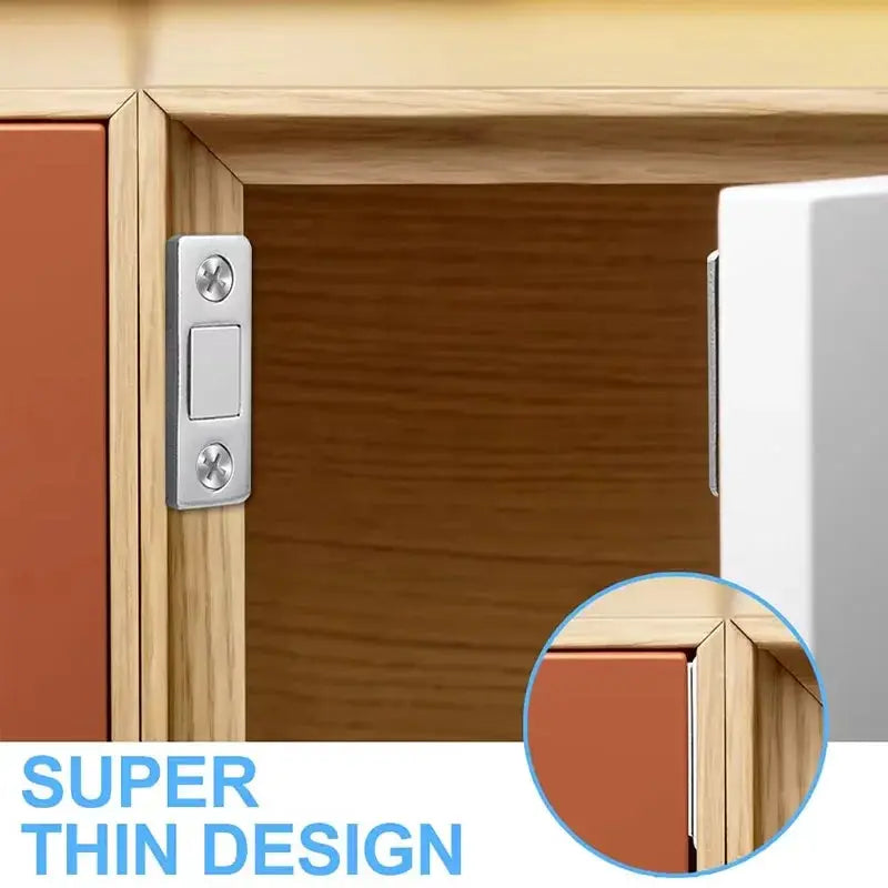 Magnetic cabinet catch; ultra-thin silver mounting plate with two screws on a wooden cabinet.