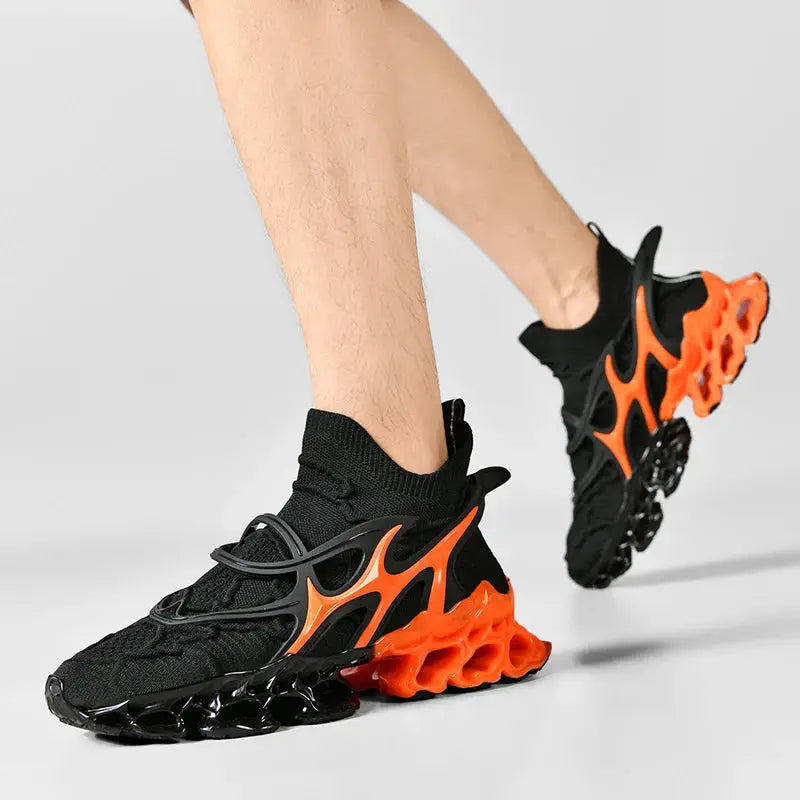 Pair of Simples Market men's sneakers, black knit upper with orange lattice midsole/outsole.