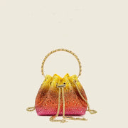 Rhinestone gradient evening clutch bag with gold chain handle and drawstring, yellow to pink crystal purse.