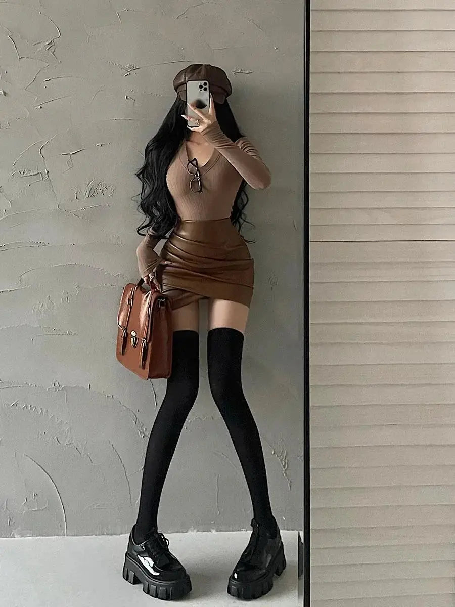 WOMENGAGA Spicy Girl PU Leather Mini Skirt, brown high-waist A-line with wrinkle-wrapped design