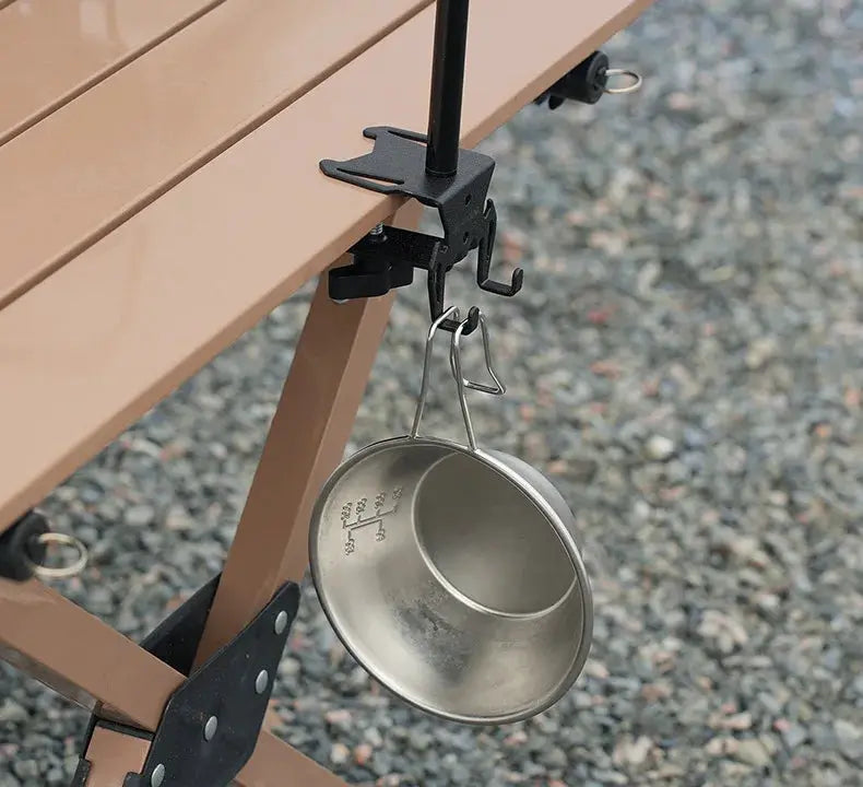 Simples Market Black Hang Gas Canister Hook with hanging plate and bottle opener on outdoor table; camping cup hangs.