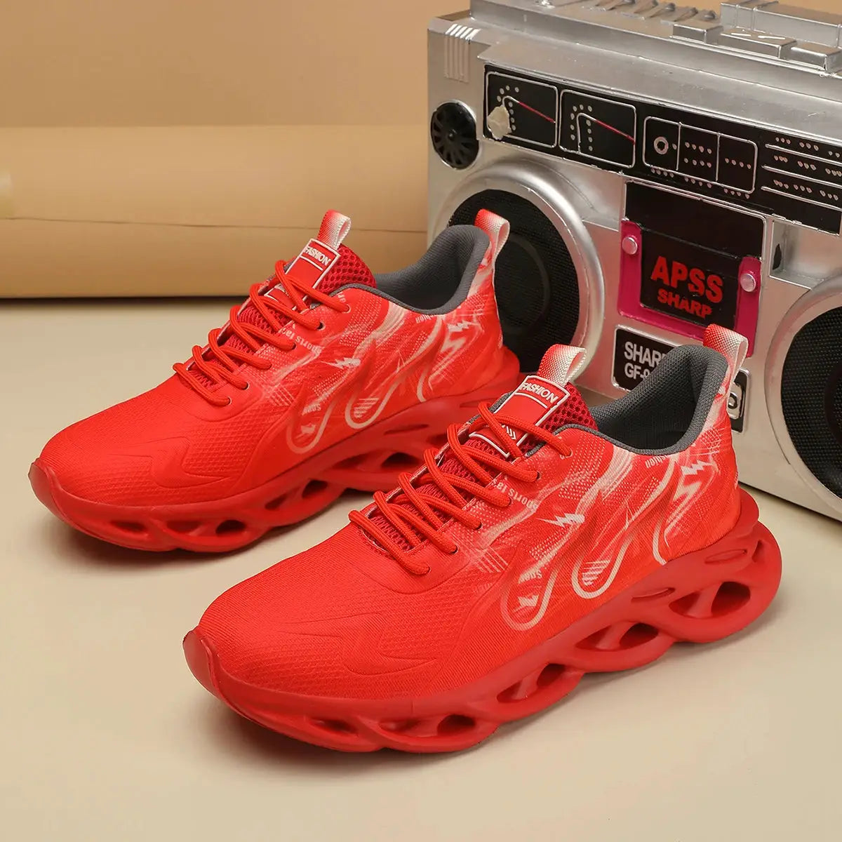 Pair of unisex red running shoes, lightweight breathable mesh, lace-up sneakers