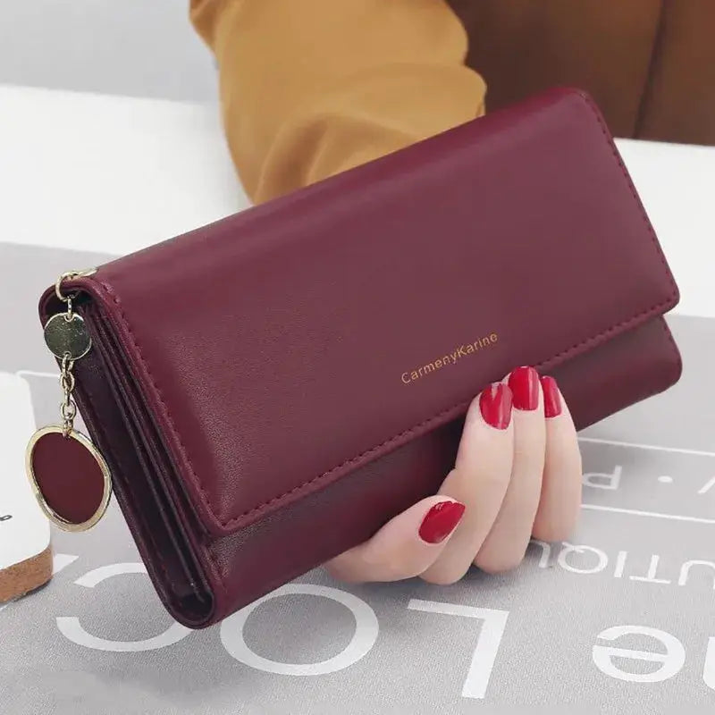 Long PU leather wallet in maroon by Carmen y Karine with card holder and gold charm