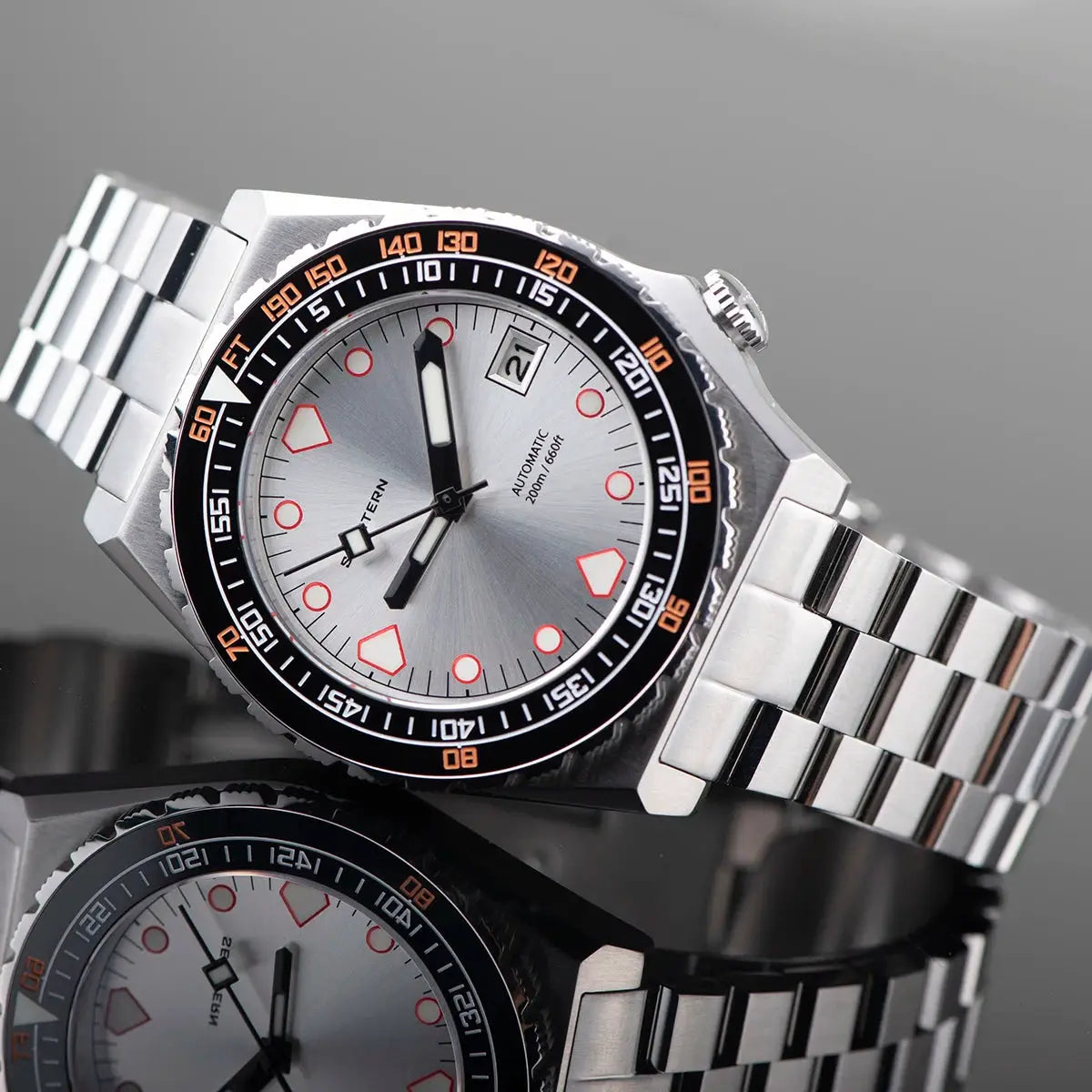 SEESTERN SUB600T diver watch; stainless steel bracelet, silver dial, black bezel with orange numerals, date window