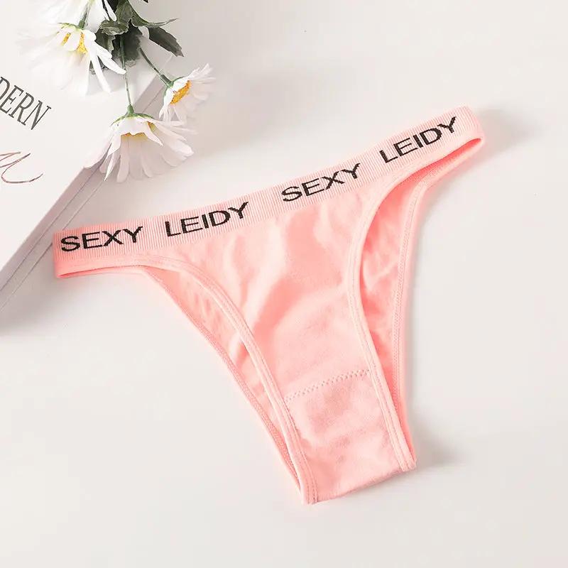 Pink thong underwear with high-leg cut and branded SEXY LEIDY elastic waistband.