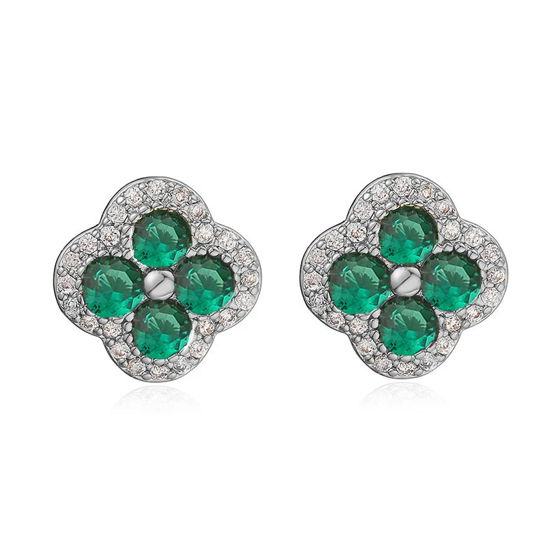 Flower-shaped earrings in silver-tone metal with four emerald-green CZ stones and a clear pave halo, 2 earrings.