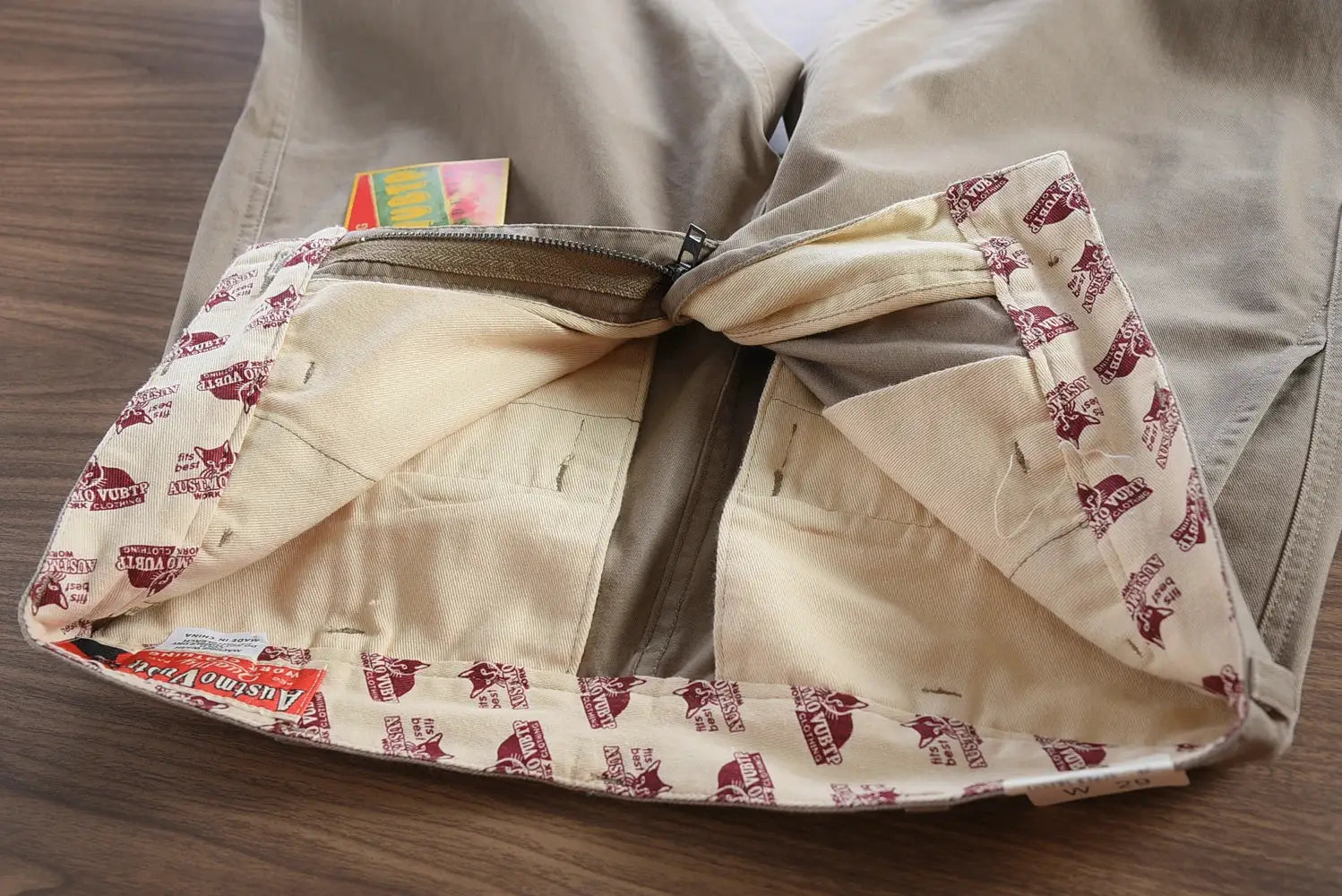Simples Market tan cotton twill driving pants for men with zip fly and inner pockets.