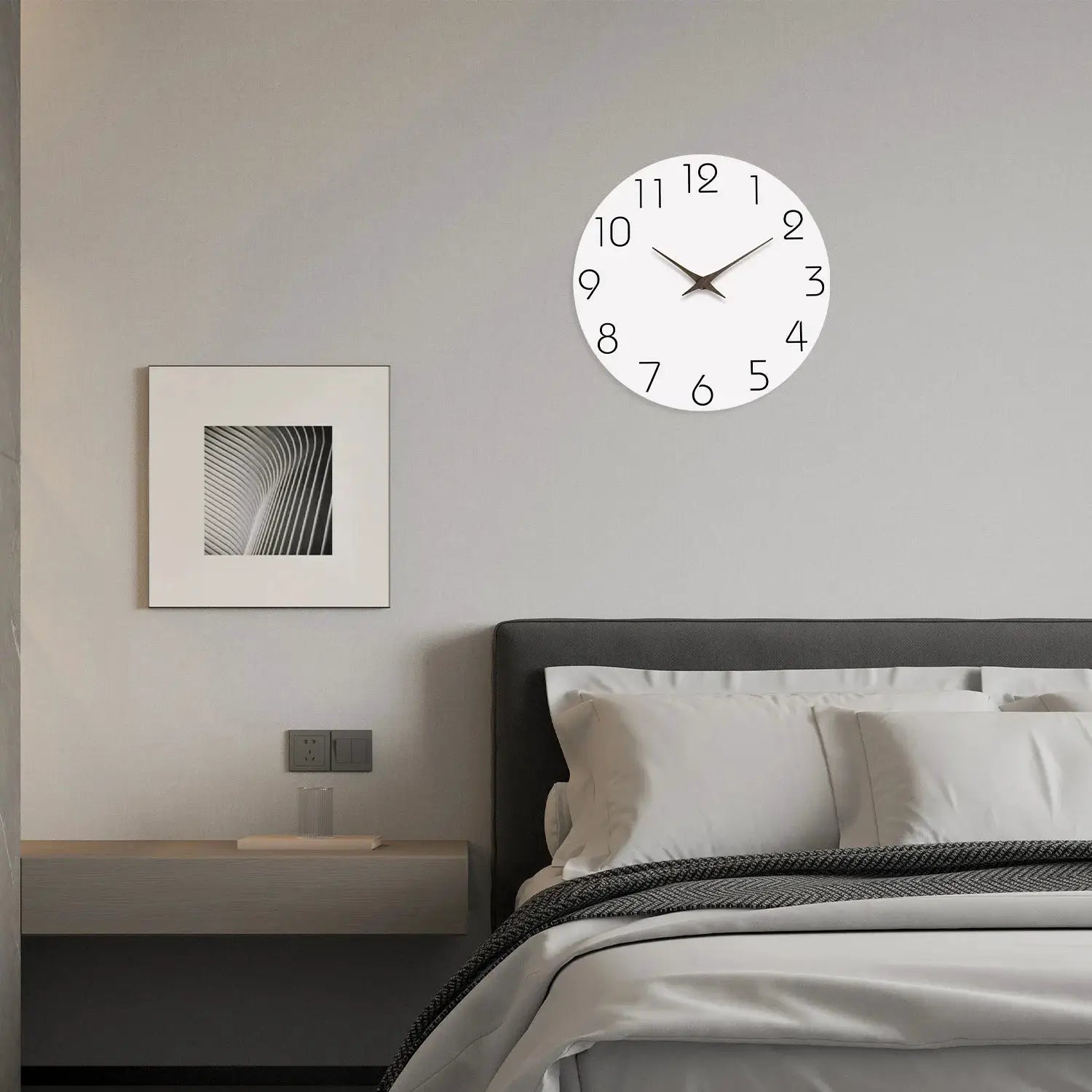 Wall clock by Simples Market, casual modern white face with black numerals, silent quartz for bedroom decor.