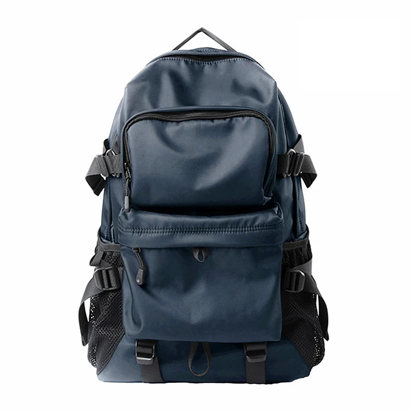 ZUOKEDISI travel backpack navy blue with front zip pocket, 15.6-inch laptop compartment, shoe box and luggage strap.