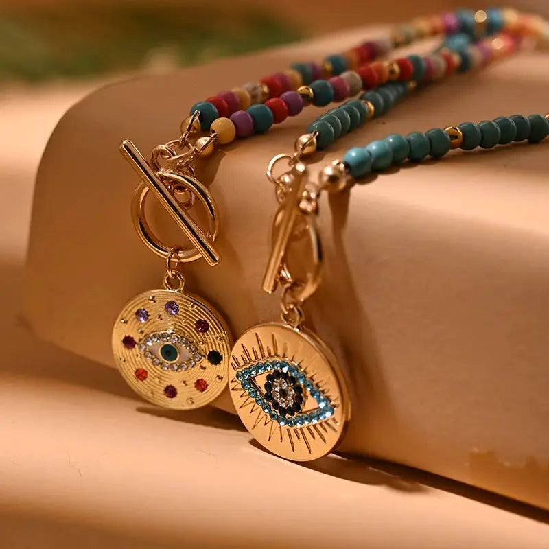 Simples Market 4mm colorful stone choker necklace with two round evil eye charms, seed beads, gold-tone accents.