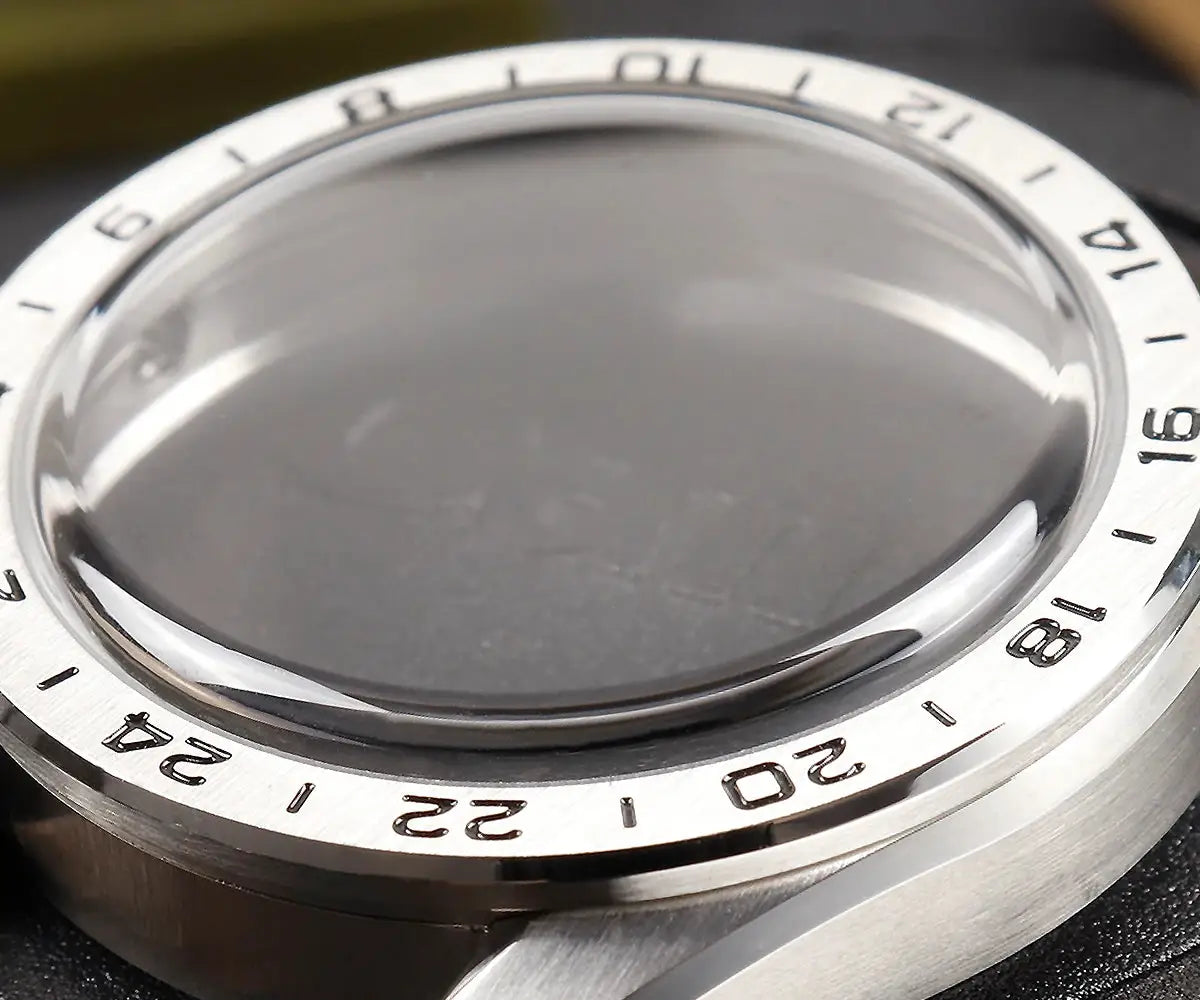 Cronos GS mechanical men's watch back close-up; brushed stainless case with 24-hour bezel and bubble sapphire crystal