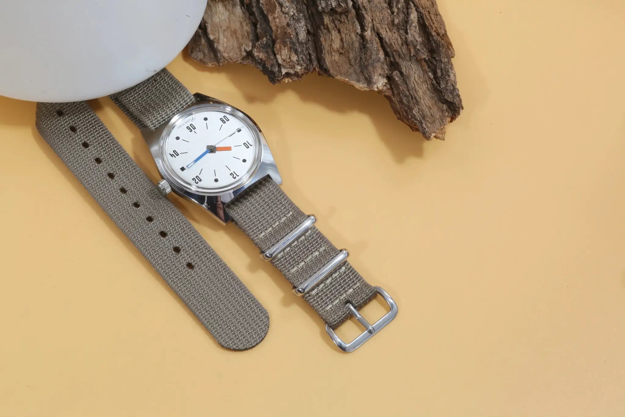 7120 Hand-Wind Mechanical Watch for Men by Simples Market with gray fabric strap and silver case.