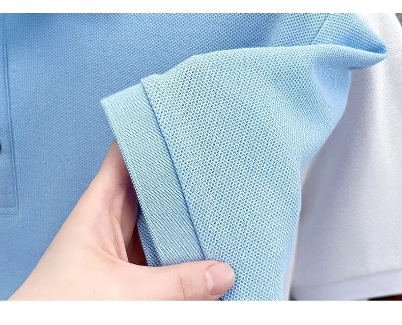 Men's blue cotton polo shirt sleeve close-up; textured knit fabric