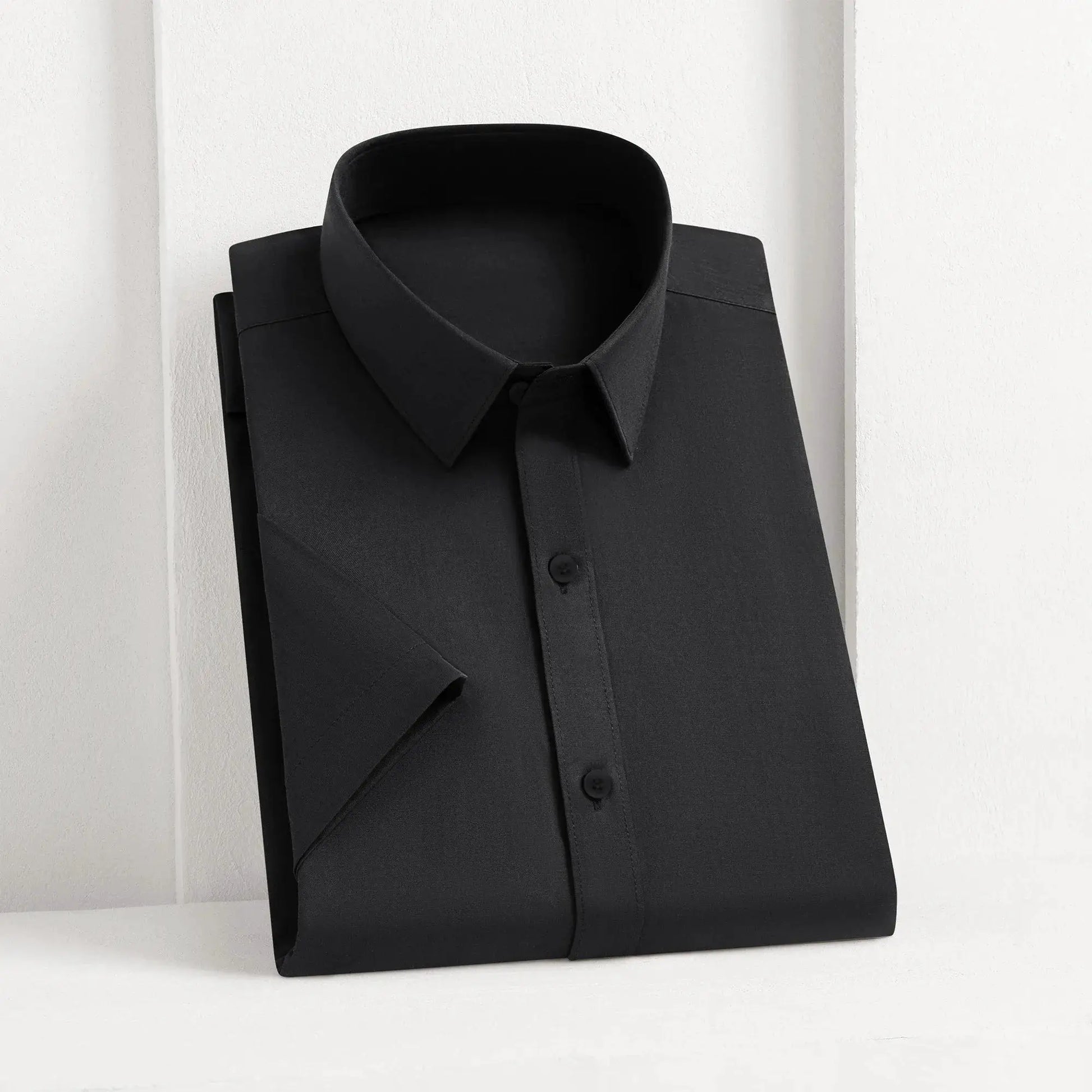 Men's black solid dress shirt, button-down with collar, neatly folded
