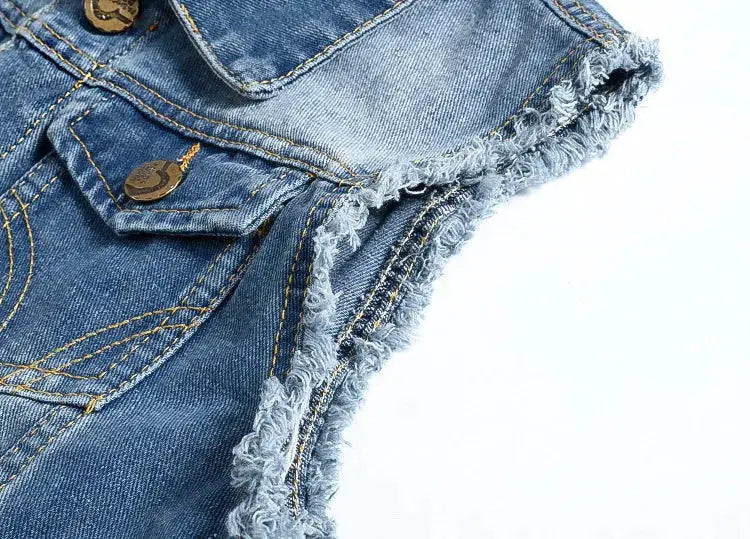 Blue denim sleeveless vest with frayed edges and brass button pocket detail.