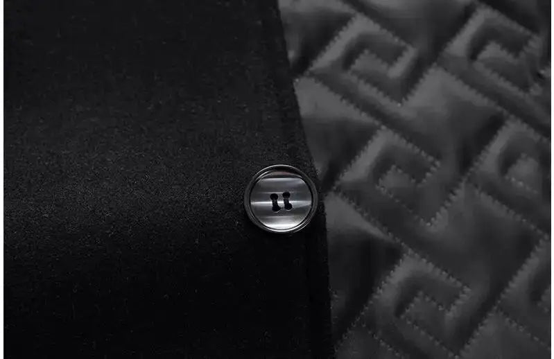 Men's black trench coat with metal button and quilted lining.