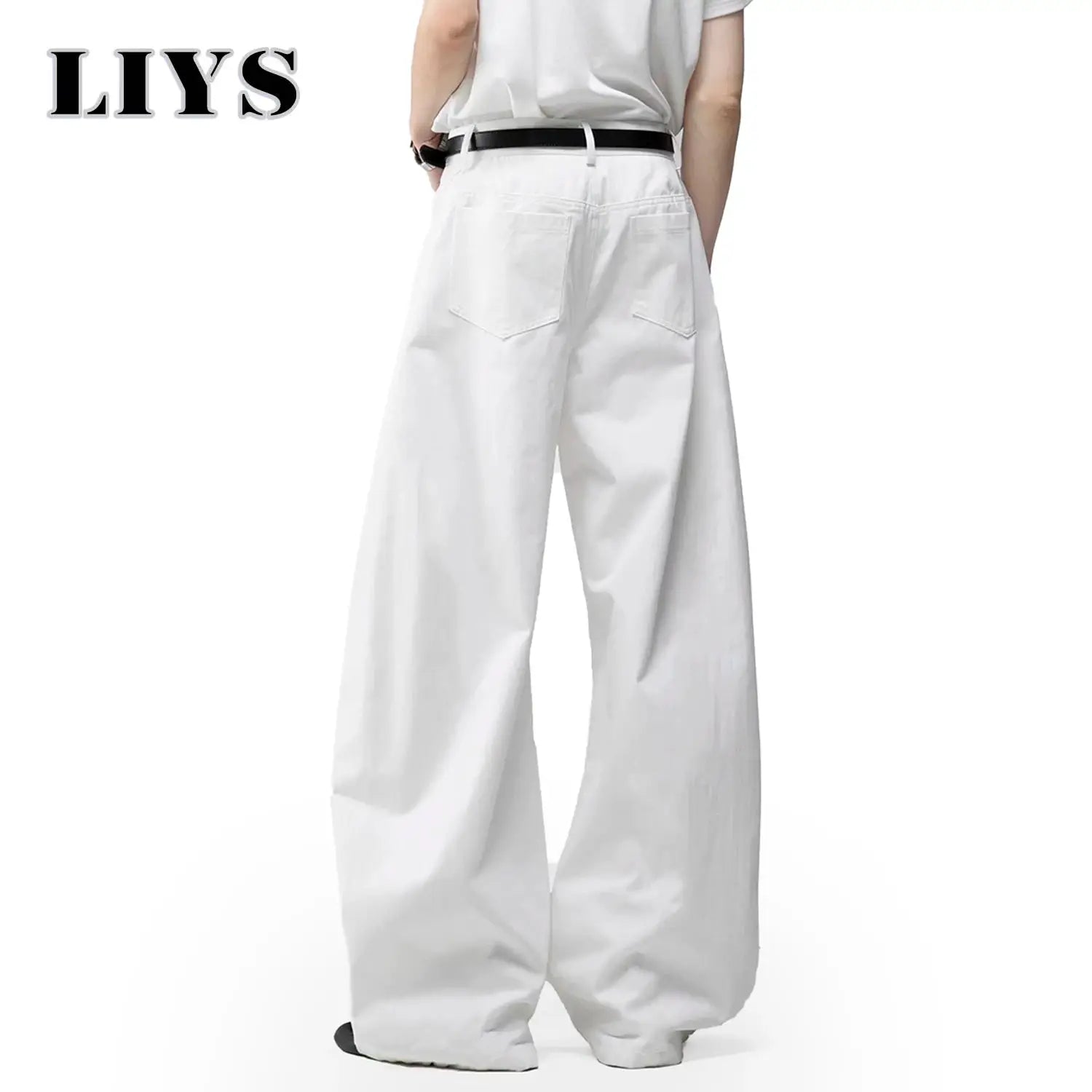Men's white baggy wide-leg denim jeans by Simples Market, back view with black belt