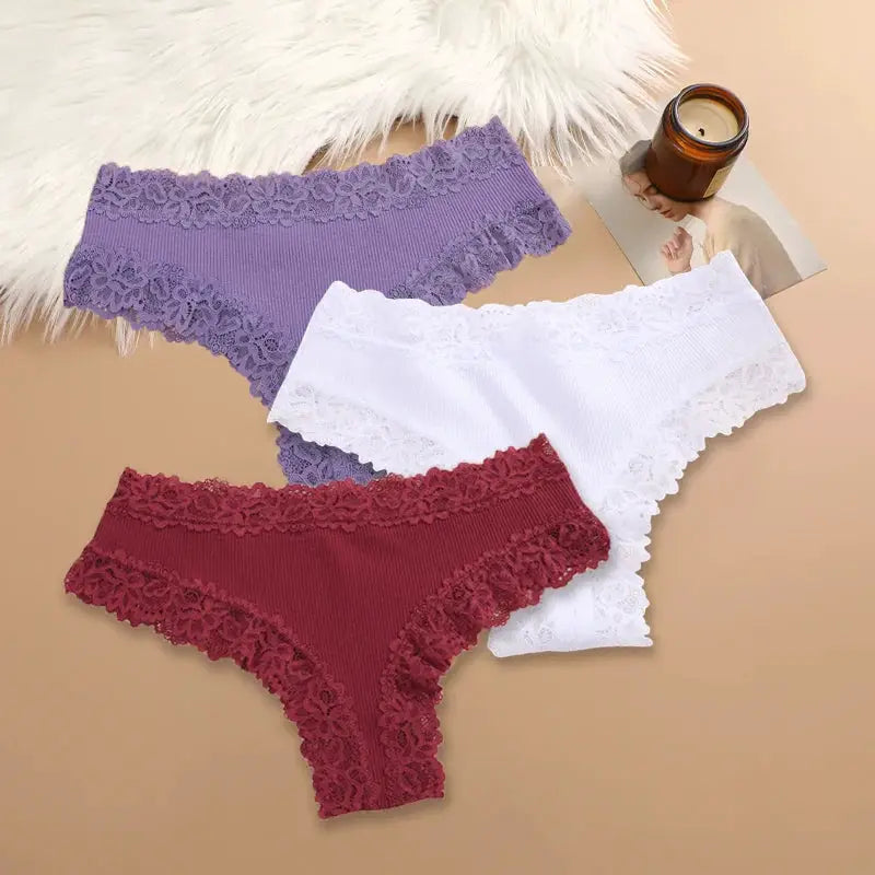 3-piece set of women's cotton panties with floral lace trim in purple, white, and burgundy.