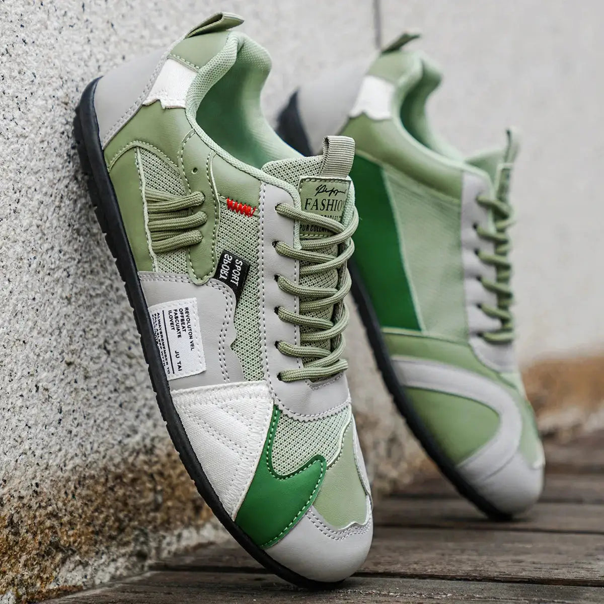Pair of men's hiking sneakers in green and gray for casual outdoor streetwear