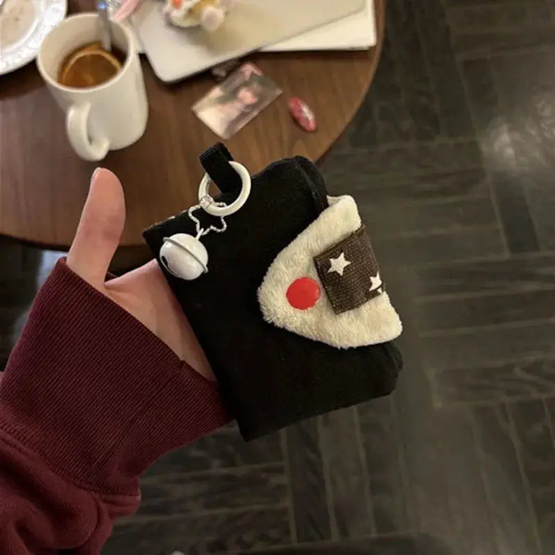 Rice ball card holder purse by Simples Market; black fabric with cream plush flap and star/red patch, key ring charm