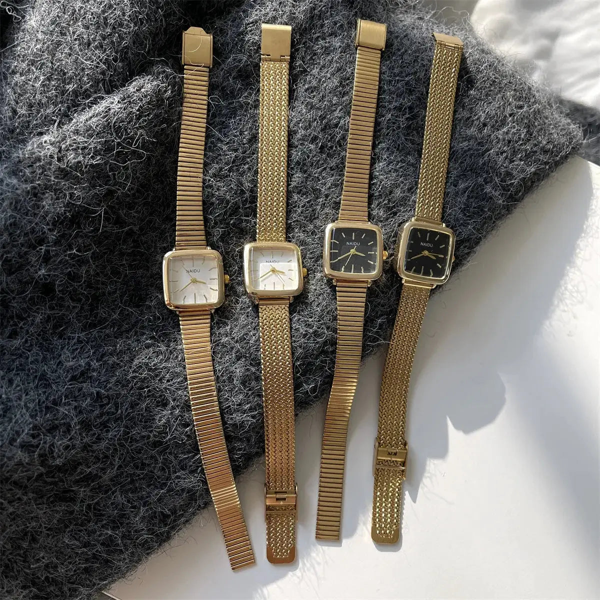 Gold-tone women's quartz watches set of four with square faces, NAIDU branding, and adjustable stainless steel bands