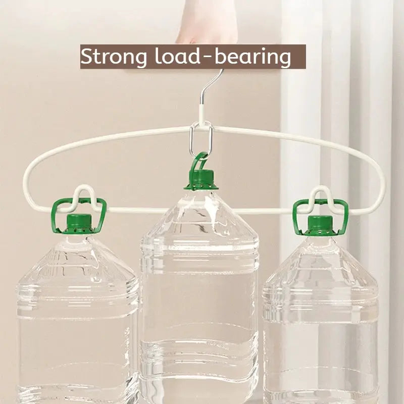 White oval clothes hanger rack with 3 green-lidded bottle hooks; strong load-bearing