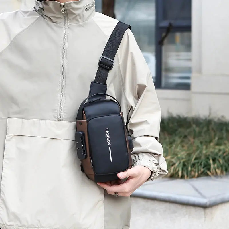 Men anti-theft chest bag crossbody USB charging, black with brown accents, compact sling for school and gym.