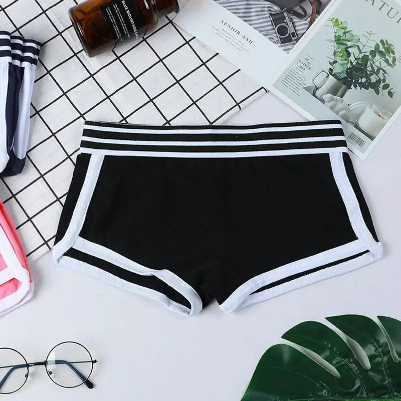 Women's low-waist boxer boyshorts in black with white trim and striped waistband